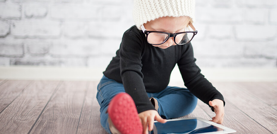 baby reading an ipad with glasses - Book Design